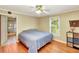 Comfortable bedroom with hardwood floors, natural light and easy access to the bathroom at 251 Charles Riddle Rd, Sanford, NC 27330
