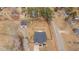 Aerial view of home showcasing mature trees, storage shed, large lot, and neighborhood at 2690 Meadow View Ln, Sanford, NC 27332