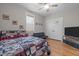 Cozy bedroom features hardwood floors, ceiling fan, and ample closet space at 2690 Meadow View Ln, Sanford, NC 27332