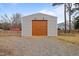 New garage exterior with a brown door and siding is perfect for a workshop and equipment storage at 2690 Meadow View Ln, Sanford, NC 27332