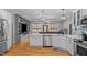 Modern kitchen with white cabinets, stainless steel appliances, and an open layout at 2690 Meadow View Ln, Sanford, NC 27332