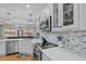 Stylish kitchen showcasing updated appliances, backsplash, and ample counter space at 2690 Meadow View Ln, Sanford, NC 27332