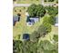 An overhead view of the house with a large, enclosed backyard and a detached garage on a tree-lined property at 2717 Jack Rd, Clayton, NC 27520