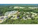 Aerial perspective of the property surrounded by mature trees in a residential area, offering privacy and tranquility at 2717 Jack Rd, Clayton, NC 27520