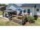 Inviting backyard featuring a charming patio with gazebo, wooden deck, manicured lawn, perfect for outdoor living at 2717 Jack Rd, Clayton, NC 27520