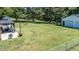 Sprawling backyard featuring a patio, gazebo, detached garage, providing ample space for outdoor activities at 2717 Jack Rd, Clayton, NC 27520