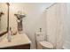 Clean bathroom featuring a vanity, toilet, and shower with a decorative curtain, designed for comfort and convenience at 2717 Jack Rd, Clayton, NC 27520