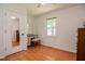 Spare bedroom with a vanity, hardwood flooring, and a light and airy aesthetic at 2717 Jack Rd, Clayton, NC 27520