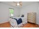 Cozy bedroom with light wood floors and ample natural light from the window at 2717 Jack Rd, Clayton, NC 27520