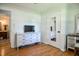Bedroom featuring a sleek white dresser and a door with a mirror insert, offering ample storage at 2717 Jack Rd, Clayton, NC 27520