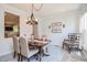 Cozy dining room featuring a rustic chandelier, comfortable seating, and decor, perfect for intimate gatherings and Gathering meals at 2717 Jack Rd, Clayton, NC 27520