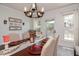 Charming dining area with a rustic chandelier and an inviting atmosphere, perfect for Gathering meals and entertaining at 2717 Jack Rd, Clayton, NC 27520