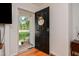 Home entryway showcasing a black front door with a decorative wreath and view of the front yard at 2717 Jack Rd, Clayton, NC 27520