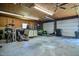 Spacious garage with a workbench, shelving, and space for vehicle storage, offering versatile utility at 2717 Jack Rd, Clayton, NC 27520