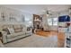 Comfortable living room featuring hardwood floors, a fireplace, and neutral décor with plenty of natural light at 2717 Jack Rd, Clayton, NC 27520