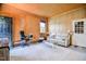 Spacious living room featuring comfortable seating, a coffee table, and paneled walls at 2717 Jack Rd, Clayton, NC 27520