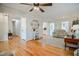 Open-concept living room with hardwood floors, connecting to other rooms in the home at 2717 Jack Rd, Clayton, NC 27520