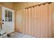 Mud room featuring a white-trimmed glass door, interior door, and bi-fold closet door at 2717 Jack Rd, Clayton, NC 27520
