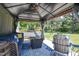 Inviting outdoor patio with comfortable seating, gazebo, and stylish décor offers a relaxing retreat at 2717 Jack Rd, Clayton, NC 27520