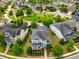 Beautiful aerial view of the neighborhood highlighting the landscaped lawns and mature trees at 281 N Serenity Hill Cir, Chapel Hill, NC 27516
