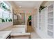 Bathroom with a walk in shower, garden tub and open shelving at 281 N Serenity Hill Cir, Chapel Hill, NC 27516