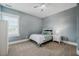 Bedroom with a soft blue color scheme, carpet, and a decorative quilt at 281 N Serenity Hill Cir, Chapel Hill, NC 27516