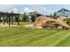 Well-maintained community common area featuring mature trees and rock features at 281 N Serenity Hill Cir, Chapel Hill, NC 27516