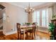 Charming dining room with hardwood floors, chandelier lighting, and large windows at 281 N Serenity Hill Cir, Chapel Hill, NC 27516
