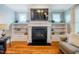 Living room fireplace featuring a black surround and white mantel at 281 N Serenity Hill Cir, Chapel Hill, NC 27516