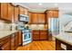 Well-equipped kitchen featuring granite countertops, stainless steel appliances, and custom cabinetry at 281 N Serenity Hill Cir, Chapel Hill, NC 27516