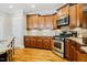 Well-equipped kitchen featuring granite countertops, stainless steel appliances, and custom cabinetry at 281 N Serenity Hill Cir, Chapel Hill, NC 27516