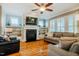 Cozy living room with fireplace, built-in shelving, and hardwood flooring at 281 N Serenity Hill Cir, Chapel Hill, NC 27516