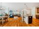 Open-concept living room and kitchen area with hardwood flooring and a seamless flow for entertaining at 281 N Serenity Hill Cir, Chapel Hill, NC 27516