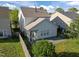 Aerial backyard view featuring lush green grass, stone patio, screened-in porch at 2812 Prospect Pkwy, Durham, NC 27703
