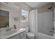 Well-lit bathroom with a single sink vanity, toilet, and shower-tub combination at 2812 Prospect Pkwy, Durham, NC 27703