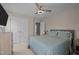 Inviting bedroom showcasing a ceiling fan, closet, and comfortable bed at 2812 Prospect Pkwy, Durham, NC 27703