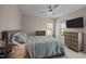 Comfortable bedroom featuring a ceiling fan and natural light from two windows at 2812 Prospect Pkwy, Durham, NC 27703