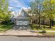 Charming home featuring a stone facade, two-car garage, and well-maintained front yard at 2812 Prospect Pkwy, Durham, NC 27703