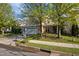 Charming two-story home with stone details, lush landscaping, and a wide driveway at 2812 Prospect Pkwy, Durham, NC 27703