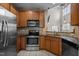 Modern kitchen featuring stainless steel appliances and granite countertops at 2812 Prospect Pkwy, Durham, NC 27703