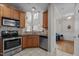 Modern kitchen featuring stainless steel appliances and granite countertops at 2812 Prospect Pkwy, Durham, NC 27703