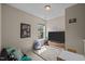 Cozy living area with bright window, entertainment center, and carpeted flooring at 2812 Prospect Pkwy, Durham, NC 27703
