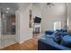 Bright living room featuring a fireplace, high ceilings, and hardwood floors at 2812 Prospect Pkwy, Durham, NC 27703