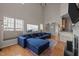 Bright living room featuring a fireplace, high ceilings, and hardwood floors at 2812 Prospect Pkwy, Durham, NC 27703