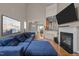 Bright living room featuring a fireplace, high ceilings, and hardwood floors at 2812 Prospect Pkwy, Durham, NC 27703