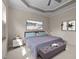 Serene main bedroom with tray ceiling, natural light, and comfortable decor at 2812 Prospect Pkwy, Durham, NC 27703