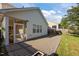 Backyard with brick patio and a screened-in porch, perfect for outdoor gatherings at 2812 Prospect Pkwy, Durham, NC 27703