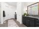 Large bathroom featuring double vanities, tiled floors, and modern fixtures at 30 Ocoee Falls Dr, Chapel Hill, NC 27517