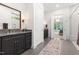 Luxurious bathroom with a double vanity, tile flooring, and modern shower at 30 Ocoee Falls Dr, Chapel Hill, NC 27517