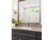 Bathroom vanity with granite countertops, dark cabinets, and modern fixtures at 30 Ocoee Falls Dr, Chapel Hill, NC 27517